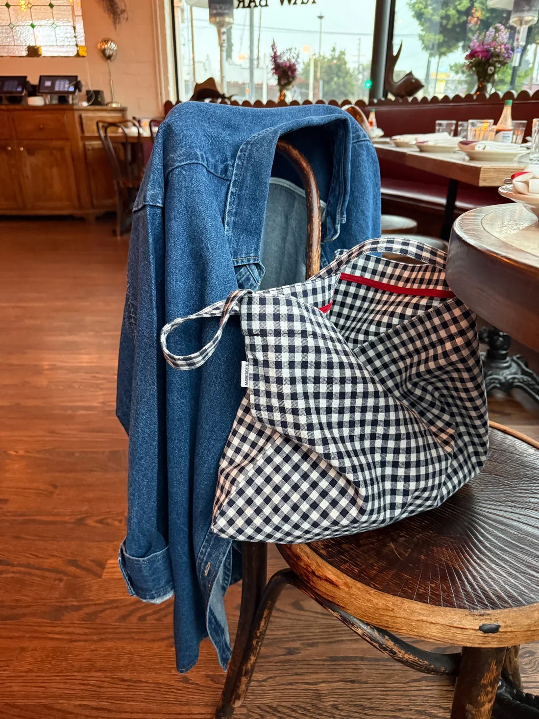 Le Bon Shoppe Carry Bag on chair